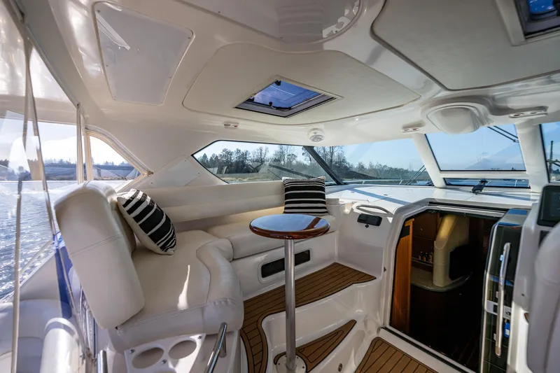 Slide: The Image of Luxurious interior of 2006 Tiara Yachts 4300 Sovran with plush seating and elegant design. - 11