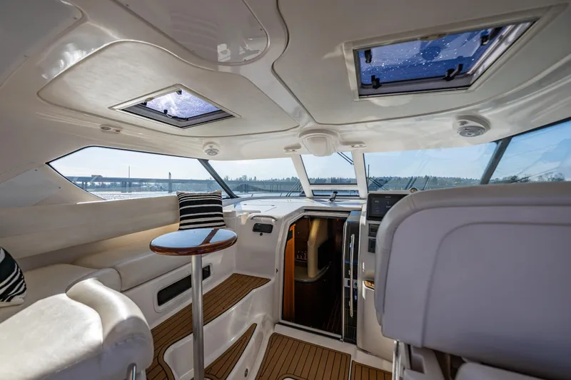 Slide: The Image of Luxurious interior of 2006 Tiara Yachts 4300 Sovran with skylights and elegant seating. - 12