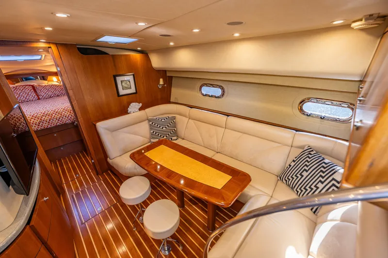 Slide: The Image of Luxurious interior of 2006 Tiara Yachts 4300 Sovran with elegant seating and wooden accents. - 16