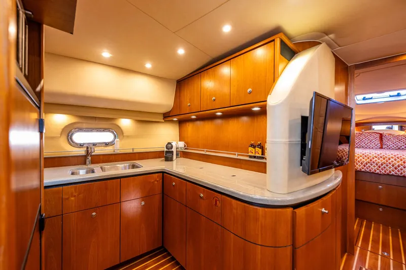 Slide: The Image of Luxurious 2006 Tiara Yachts 4300 Sovran interior with modern kitchen and cozy cabin. - 17
