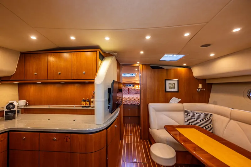 Slide: The Image of Luxurious interior of 2006 Tiara Yachts 4300 Sovran with elegant wood finishes and cozy seating. - 20