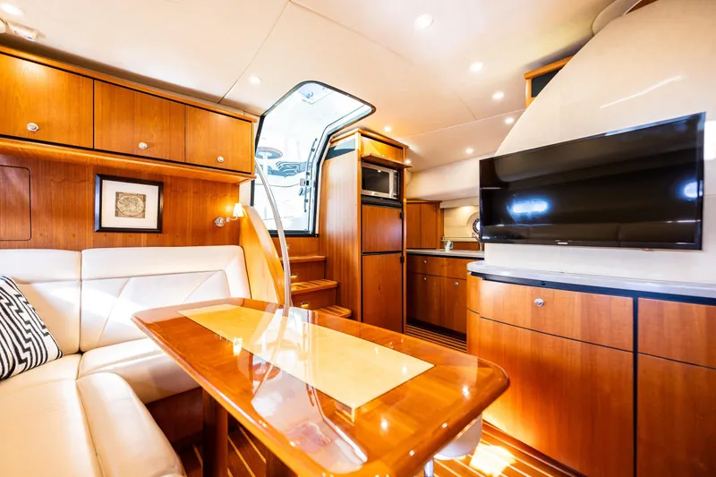 Slide: The Image of Luxurious interior of 2006 Tiara Yachts 4300 Sovran with wood finishes and modern amenities. - 21