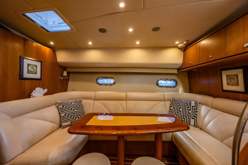 Slide: The Image of Luxurious interior of 2006 Tiara Yachts 4300 Sovran with elegant seating and wooden accents. - 22