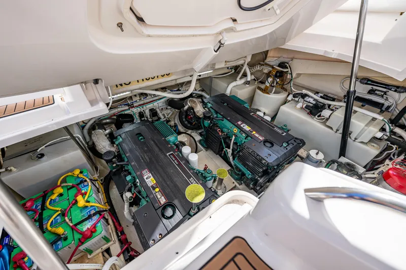 Slide: The Image of Engine room of 2006 Tiara Yachts 4300 Sovran, showcasing dual engines and wiring. - 36