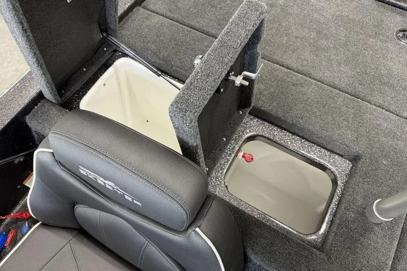 Slide: The Image of 2025 Skeeter ZX150 boat interior with storage compartments and cushioned seating. - 14