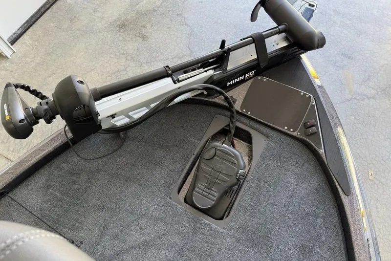 Slide: The Image of 2025 Skeeter ZX150 boat with Minn Kota trolling motor on carpeted deck. - 4