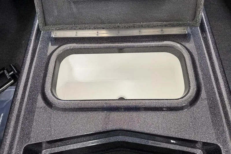 Slide: The Image of Open storage compartment in 2025 Skeeter ZX150 boat, featuring a sleek design. - 6