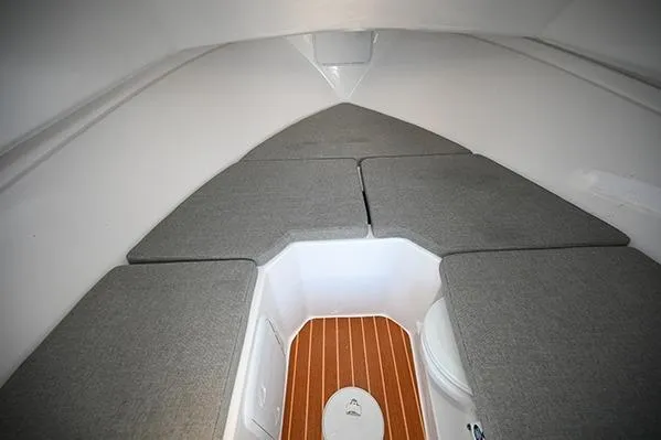 Slide: The Image of 2026 Steiger Craft 255 Miami cabin interior with cushioned seating and wooden flooring. - 5