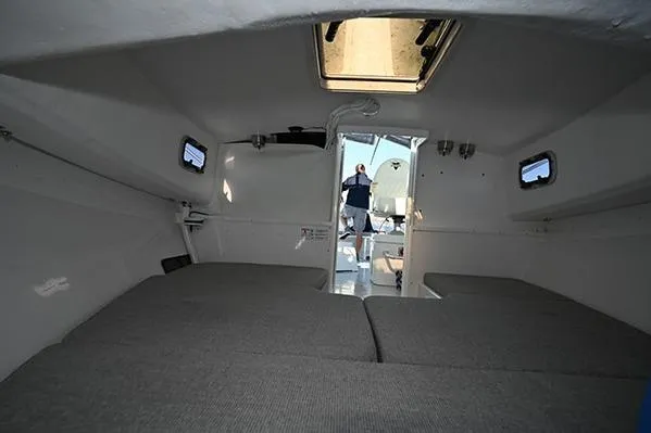 Slide: The Image of Interior cabin of 2026 Steiger Craft 255 Miami boat, featuring spacious seating and windows. - 6