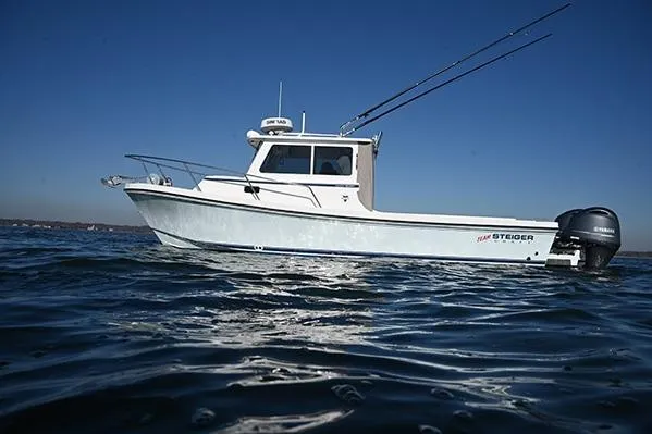 Slide: The Image of 2026 Steiger Craft 255 Miami boat on open water under clear blue sky. - 9