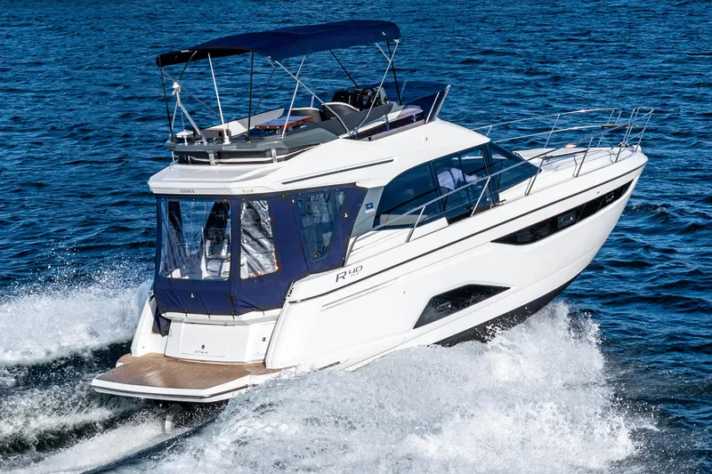 Slide: The Image of 2024 Bavaria R40 yacht cruising on open water, showcasing sleek design and luxury features. - 10