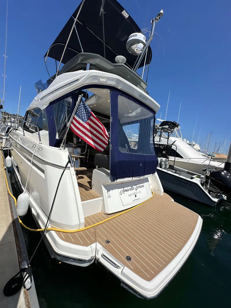 Slide: The Image of 2024 Bavaria R40 yacht docked, featuring sleek design and American flag. - 37