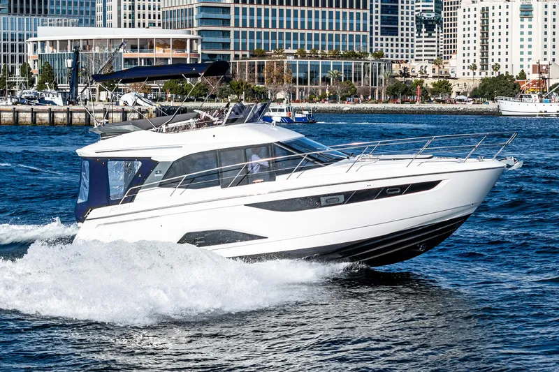 Slide: The Image of 2024 Bavaria R40 yacht cruising in urban waterfront setting. - 6