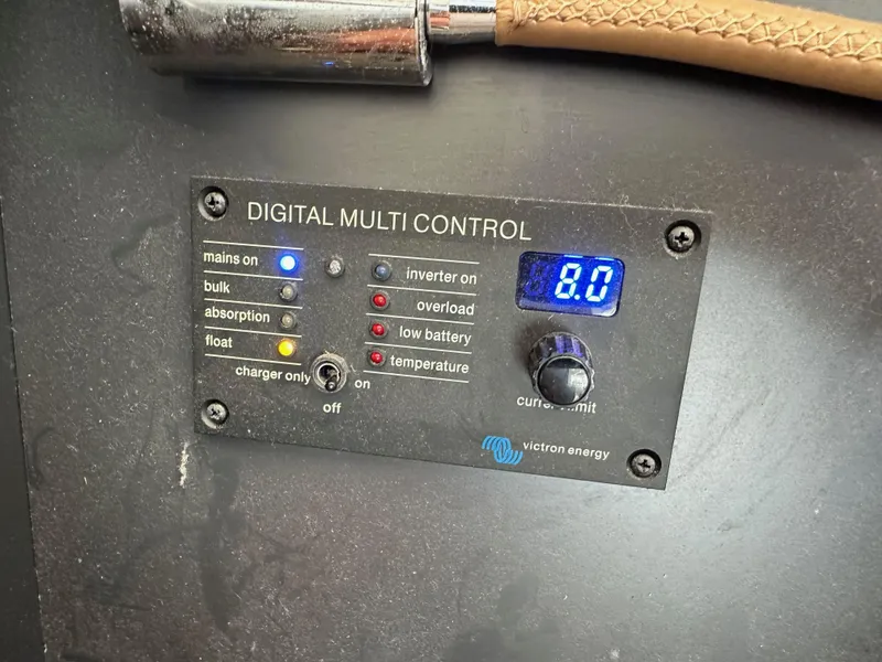 Slide: The Image of Digital multi control panel with various indicators and a display reading 8.0, Victron Energy. - 39