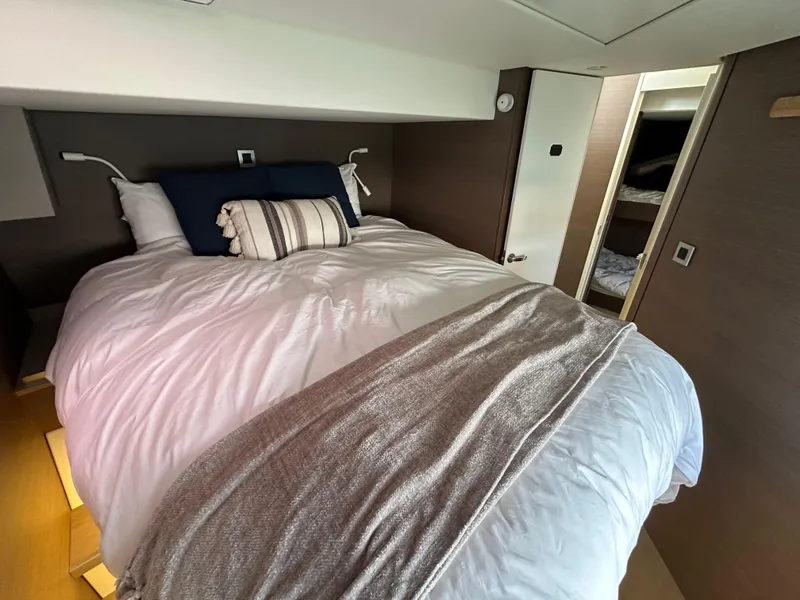 Slide: The Image of Luxurious bedroom interior in a 2021 Bali 4.8 yacht, featuring a cozy bed and modern design. - 48