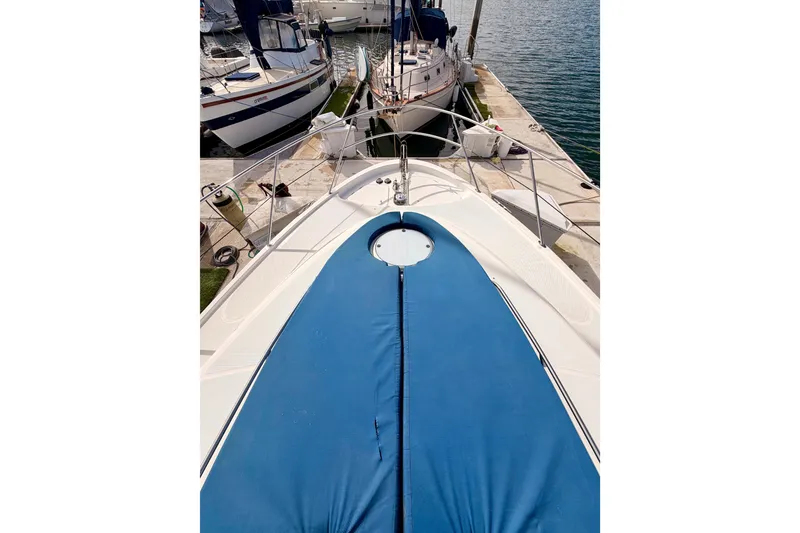 Slide: The Image of 2001 Maxum 4600 SCB Limited Edition yacht docked at marina. - 14