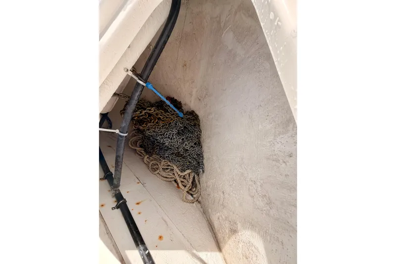 Slide: The Image of Anchor chain and rope storage in 2001 Maxum 4600 SCB Limited Edition boat. - 17