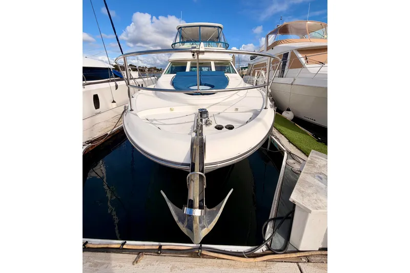 Slide: The Image of 2001 Maxum 4600 SCB Limited Edition yacht docked at marina, front view. - 2