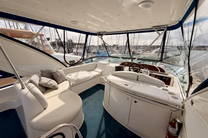 Slide: The Image of Luxurious interior of 2001 Maxum 4600 SCB Limited Edition yacht with plush seating and helm. - 24