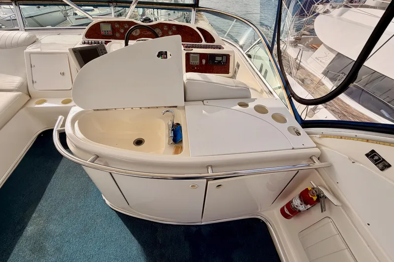 Slide: The Image of 2001 Maxum 4600 SCB Limited Edition yacht cockpit with sink and control panel. - 28