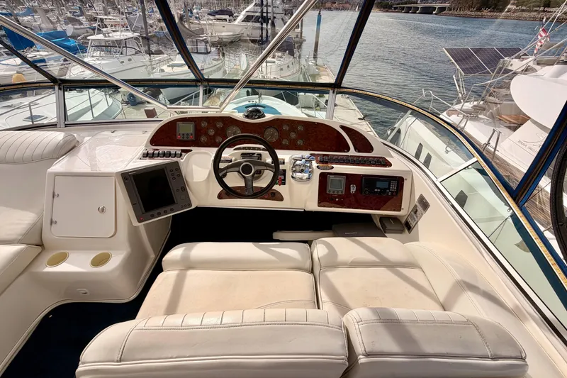 Slide: The Image of Cockpit of 2001 Maxum 4600 SCB Limited Edition yacht with marina view. - 29