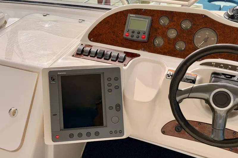 Slide: The Image of Control panel of 2001 Maxum 4600 SCB Limited Edition yacht with steering wheel and navigation display. - 32