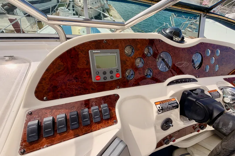 Slide: The Image of Cockpit of 2001 Maxum 4600 SCB Limited Edition yacht with control panel and gauges. - 33