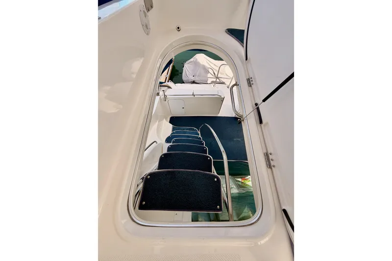 Slide: The Image of Staircase inside 2001 Maxum 4600 SCB Limited Edition yacht, featuring sleek design and blue carpeting. - 37