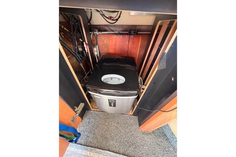 Slide: The Image of Compact washing machine in 2001 Maxum 4600 SCB Limited Edition yacht interior. - 43