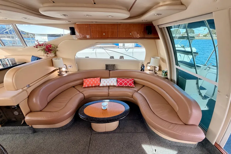 Slide: The Image of Luxurious interior of 2001 Maxum 4600 SCB yacht with curved leather seating and elegant decor. - 44