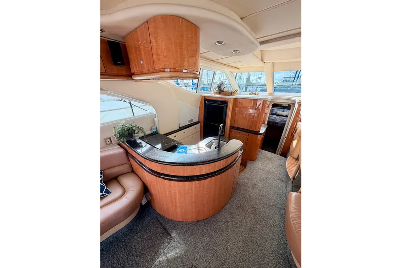 Slide: The Image of Luxurious interior of 2001 Maxum 4600 SCB yacht with modern kitchen and seating area. - 45