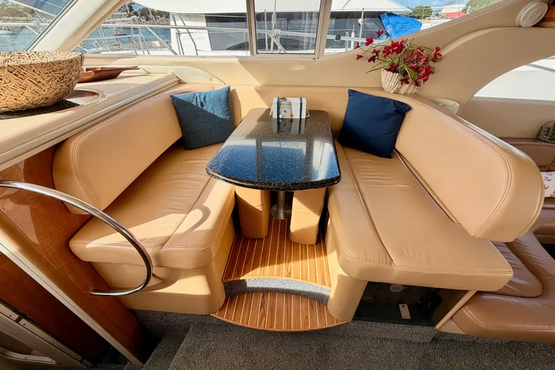 Slide: The Image of Luxurious interior of 2001 Maxum 4600 SCB yacht with leather seating and elegant table. - 54