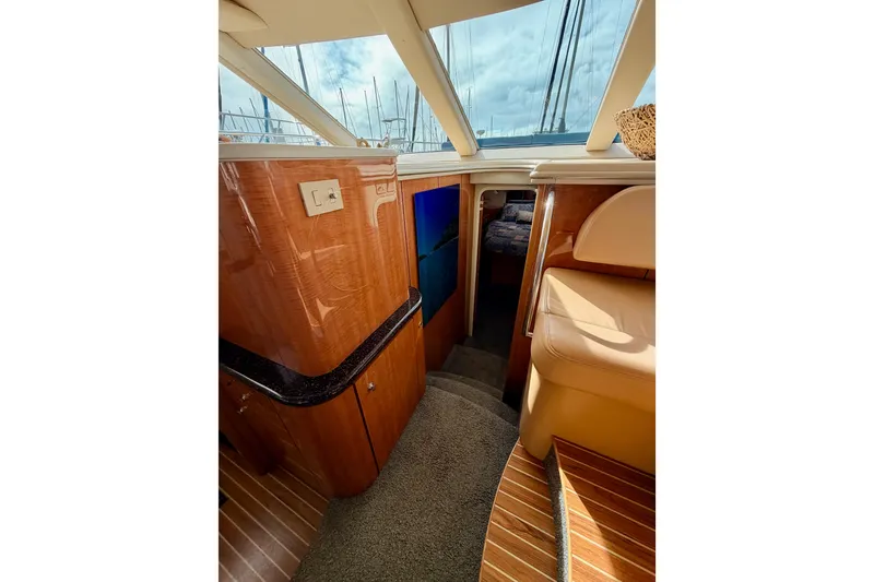 Slide: The Image of Interior of 2001 Maxum 4600 SCB Limited Edition yacht with wood finishes and seating. - 55
