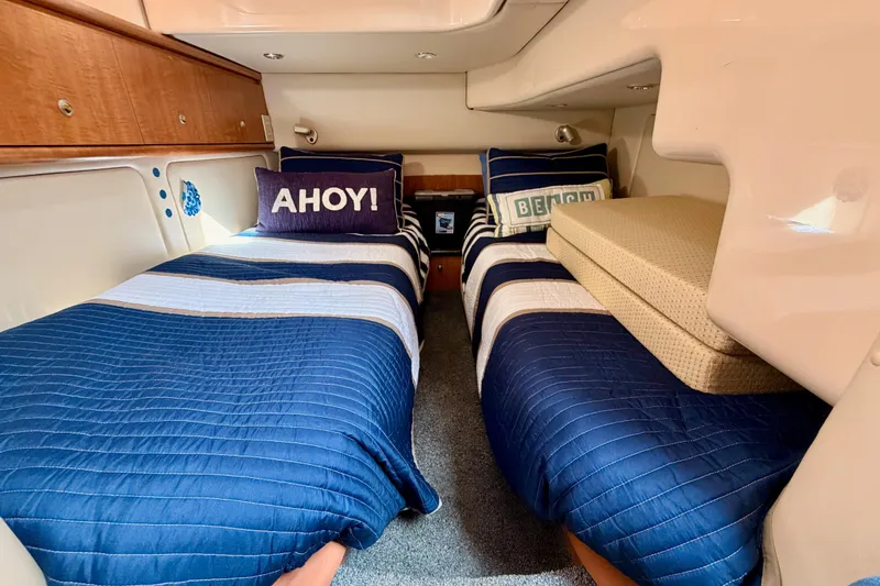 Slide: The Image of 2001 Maxum 4600 SCB Limited Edition cabin with twin beds, nautical decor, and cozy bedding. - 59