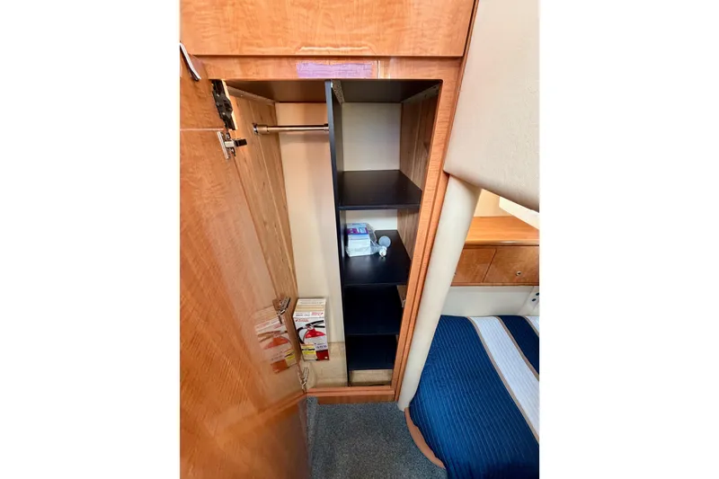 Slide: The Image of Interior of 2001 Maxum 4600 SCB Limited Edition yacht with open closet and shelves. - 60