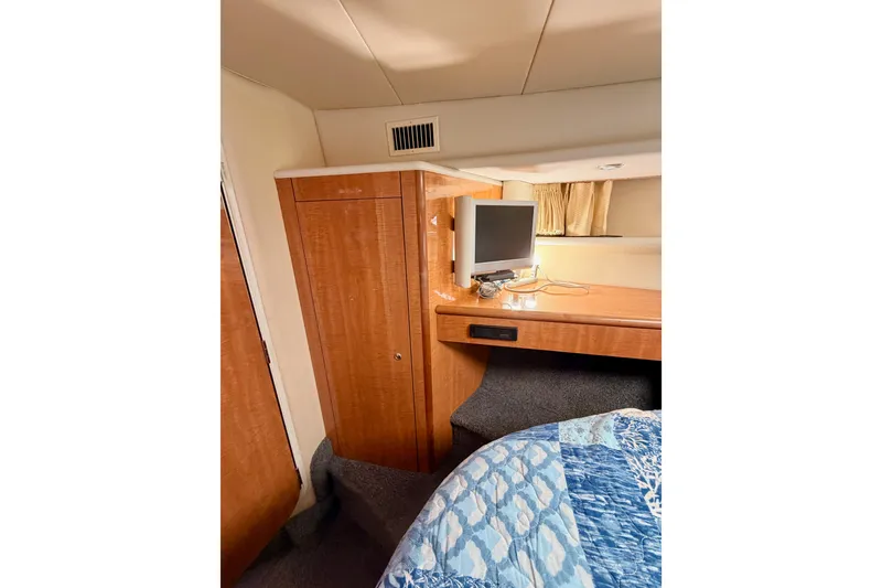 Slide: The Image of Interior of 2001 Maxum 4600 SCB yacht with wood cabinetry and small TV. - 68