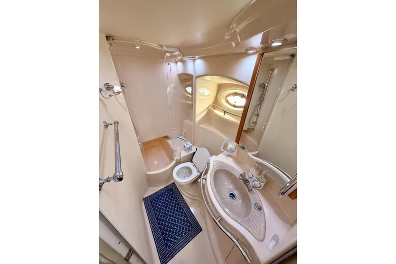Slide: The Image of Luxurious bathroom in 2001 Maxum 4600 SCB Limited Edition yacht, featuring shower and sink. - 69