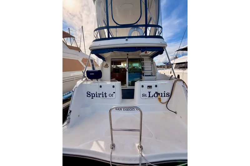 Slide: The Image of 2001 Maxum 4600 SCB Limited Edition yacht docked, named "Spirit of St. Louis," in San Diego. - 7