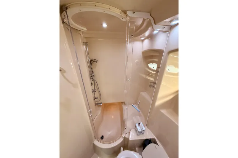 Slide: The Image of Bathroom interior of 2001 Maxum 4600 SCB Limited Edition yacht, featuring shower and toilet. - 70