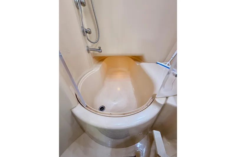 Slide: The Image of 2001 Maxum 4600 SCB Limited Edition yacht shower with curved design and handheld showerhead. - 71