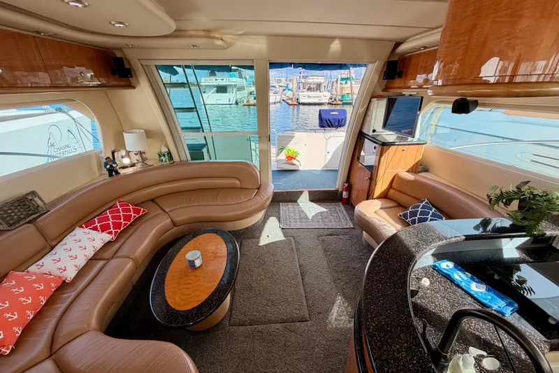 Slide: The Image of Luxurious interior of 2001 Maxum 4600 SCB yacht with leather seating and waterfront view. - 78
