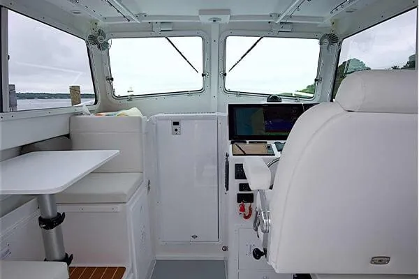 Slide: The Image of Interior of 2026 Steiger Craft 28 Fisherman boat, featuring helm and seating area. - 4