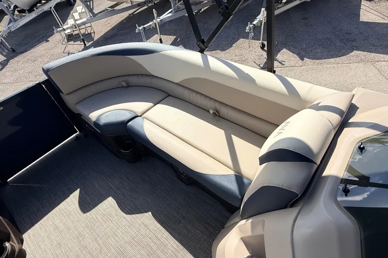 Slide: The Image of 2026 Avalon 2385 LSZ Tri Toon boat with beige and blue seating. - 15