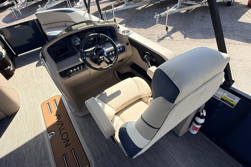 Slide: The Image of 2026 Avalon 2385 LSZ Rear Fish boat interior with steering console and seating. - 23