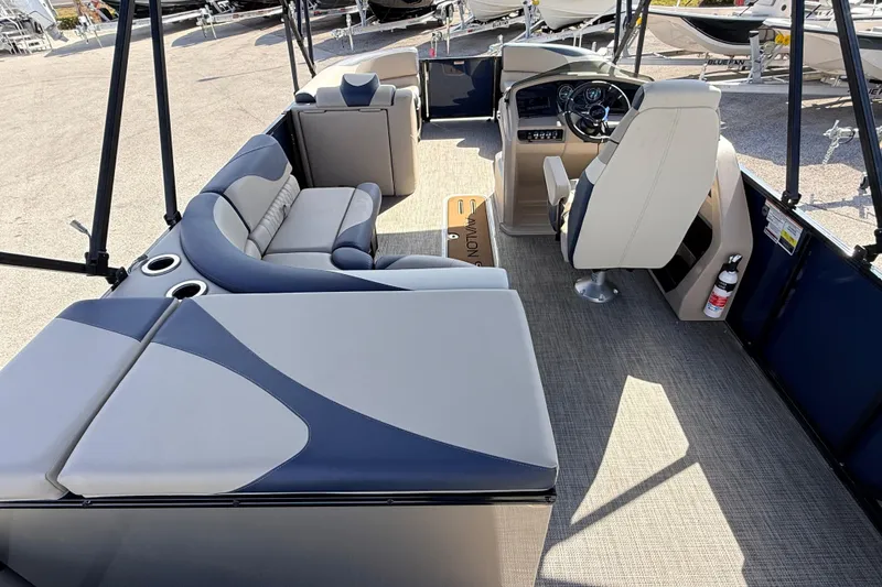 Slide: The Image of 2026 Avalon 2385 LSZ Rear Fish Tri Toon boat interior with seating and steering console. - 28