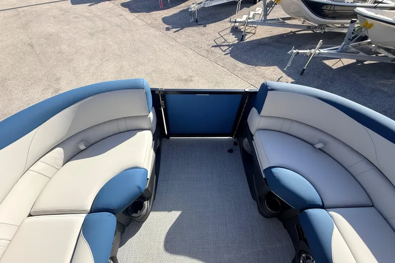Slide: The Image of 2026 Avalon 2385 LSZ Quad Lounger interior with blue and white seating, showcasing luxury design. - 17