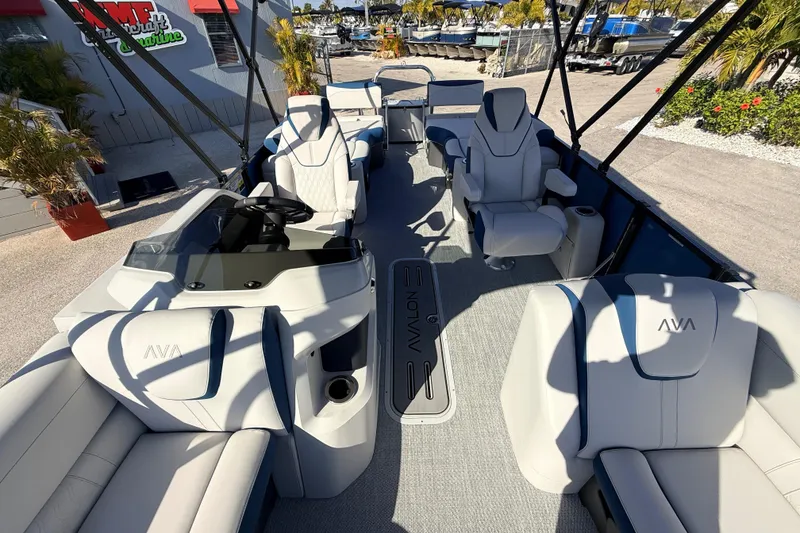 Slide: The Image of 2026 Avalon 2385 LSZ Quad Lounger Tri Toon boat interior with luxurious seating and modern design. - 18