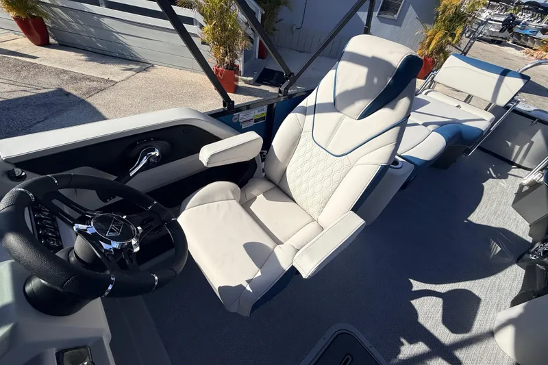 Slide: The Image of 2026 Avalon 2385 LSZ Quad Lounger interior with luxury seating and steering wheel. - 19