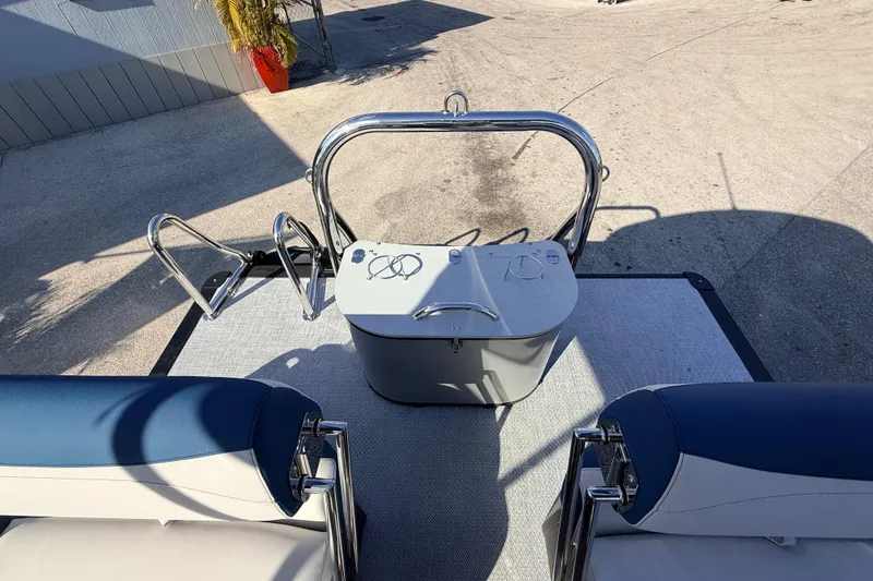 Slide: The Image of 2026 Avalon 2385 LSZ Quad Lounger Tri Toon boat interior with seating and controls. - 23