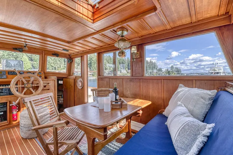 Slide: The Image of Cozy wooden interior of 1981 Nielsen 46 boat with scenic water views. - 4